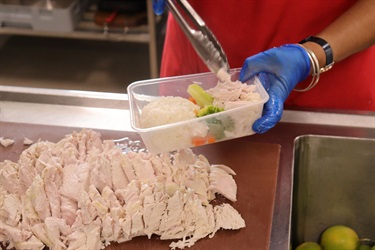 211-20260121-Aged-Care-dishing-chicken-into-meal-pack.jpg